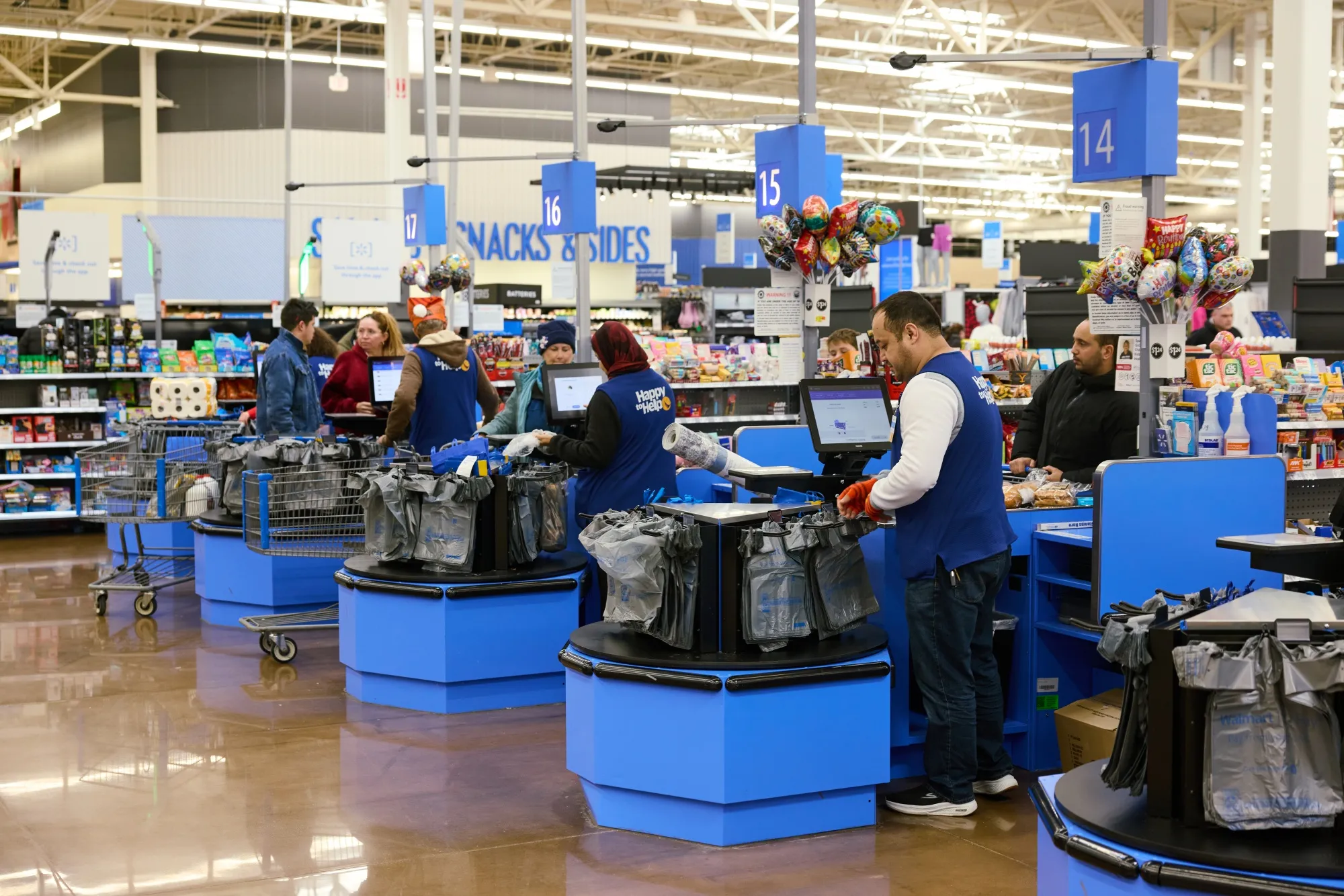 Workersata checkoutataWalmartstore inColumbus,Ohio.